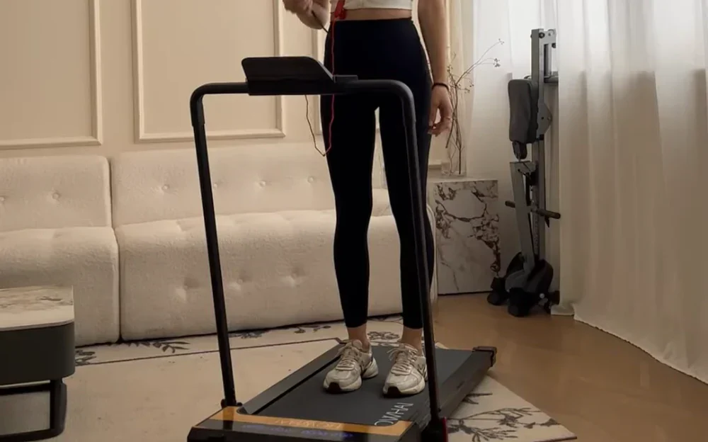 standing on the treadmill and prepare for the HIIT workout
